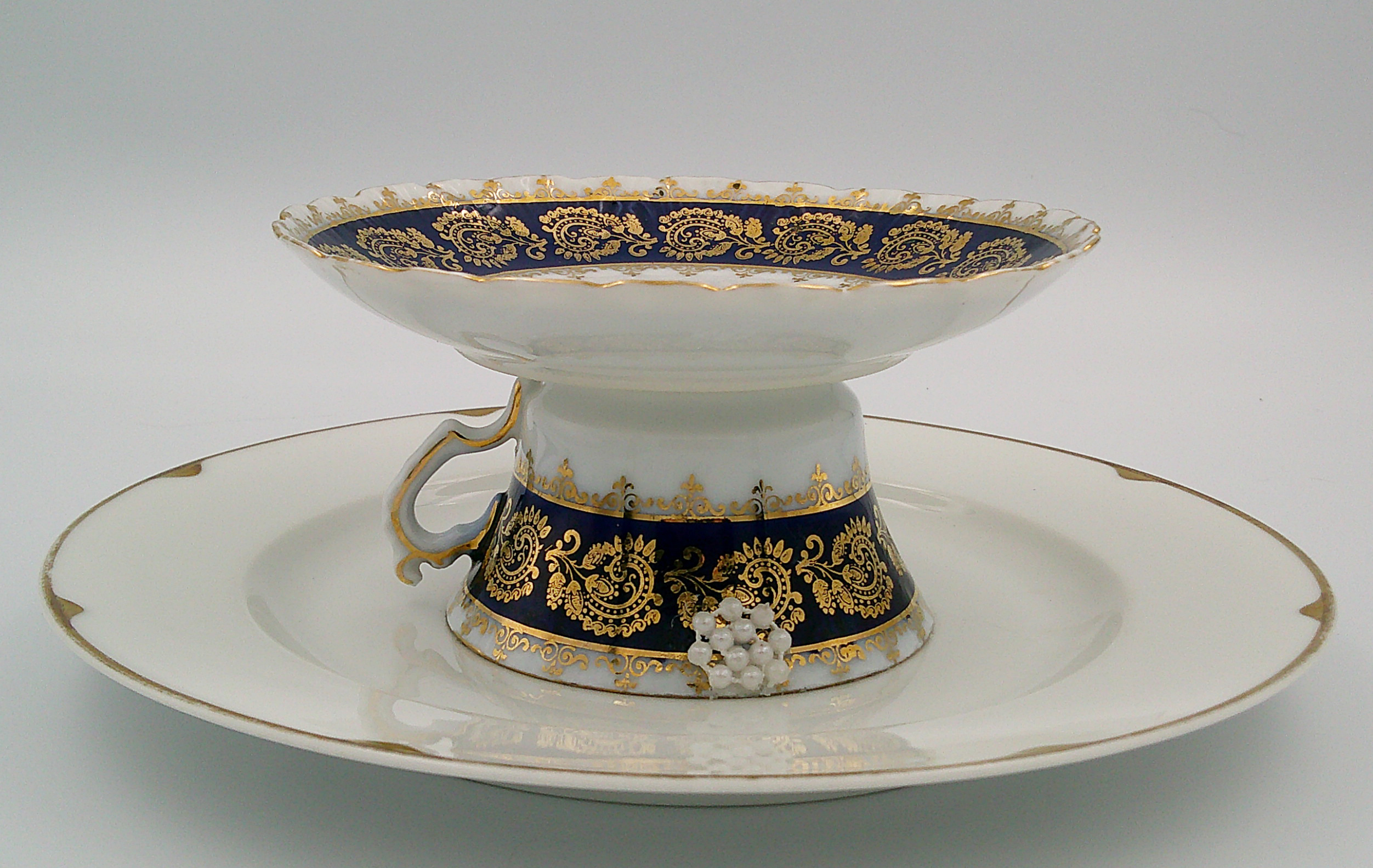 This is looking directly at the side, which shows the details of the outer edge of the cup and saucer. This is looking directly at the side, which shows the details of the outer edge of the cup and saucer.